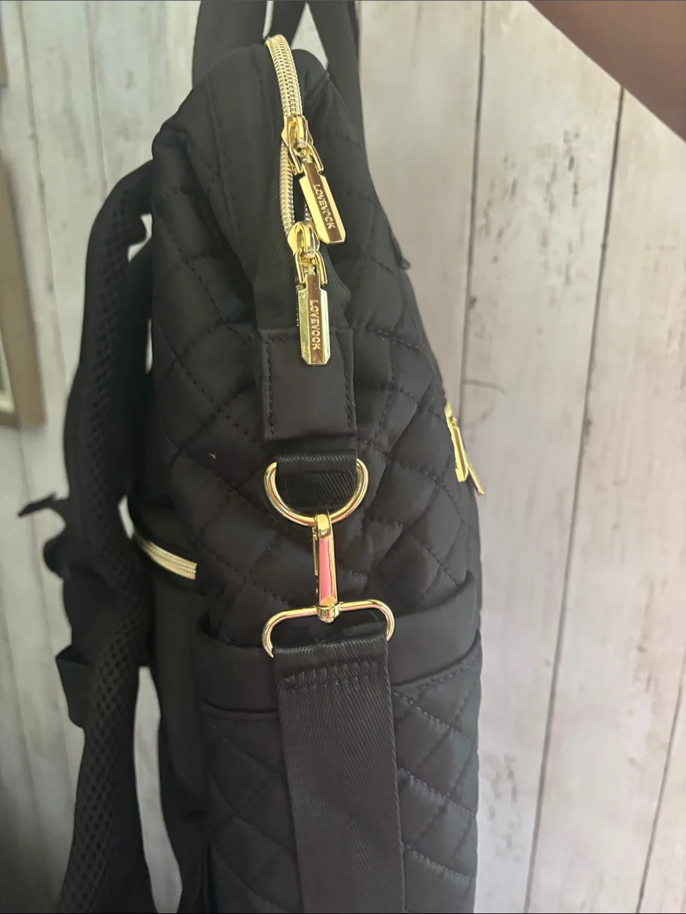 Stylish Quilted Black Backpack with Gold Hardware